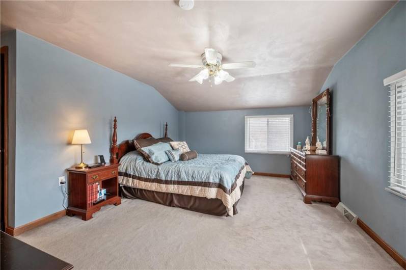 The master bedroom is sizeable and offers a spacious walk-in closet.