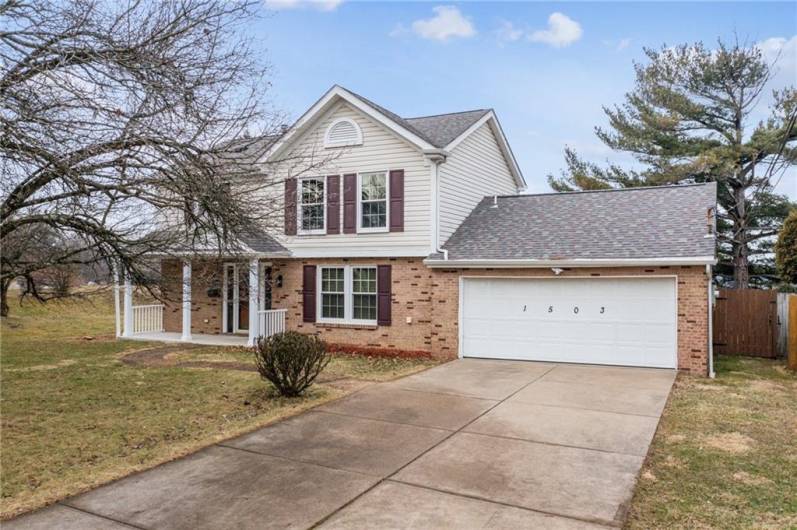 Wide Concrete driveway and 2 Car Garage