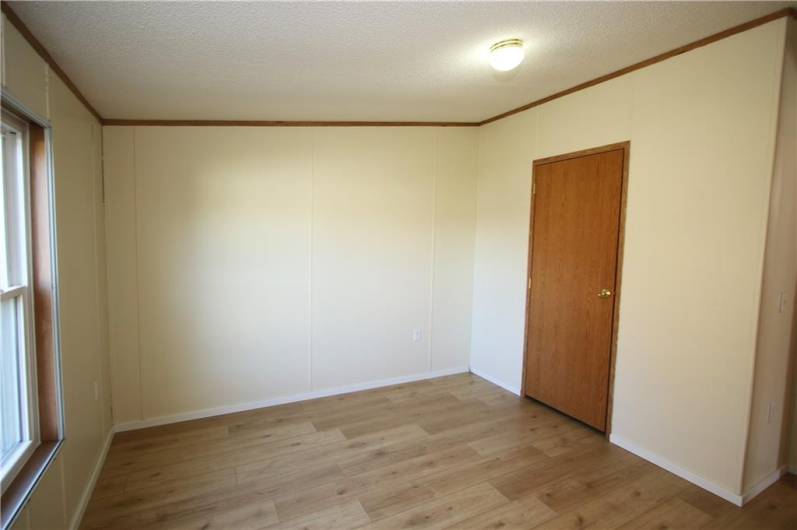 Nice 11x10 Bedroom w/ Newer Rockwood Oak Vinyl Plank Flooring, Freshly Painted & Deep Tall Closet