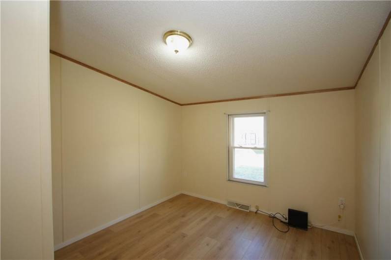 10x10 Bedroom w/ Newer Rockwood Oak Vinyl Plank Flooring, Freshly Painted & Deep Tall Closet