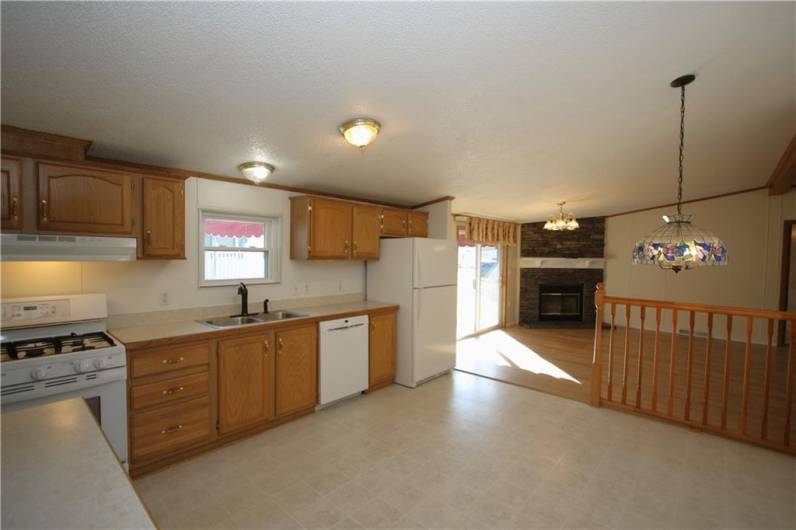 Plenty of Room for All the Chefs to prepare meals in this Big KitchenCathedral Ceilings run along middle of home allowing for an Open & Spacious Living Space everywhere!(Including extra tall bedroom closets)