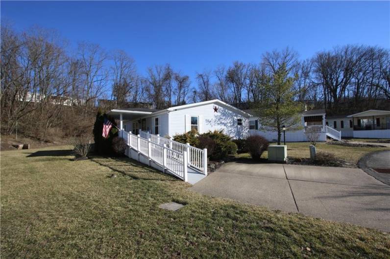 Off Street Parking for 2 Vehicles on Concrete Pad & Ramp to Covered Porch & Entrance