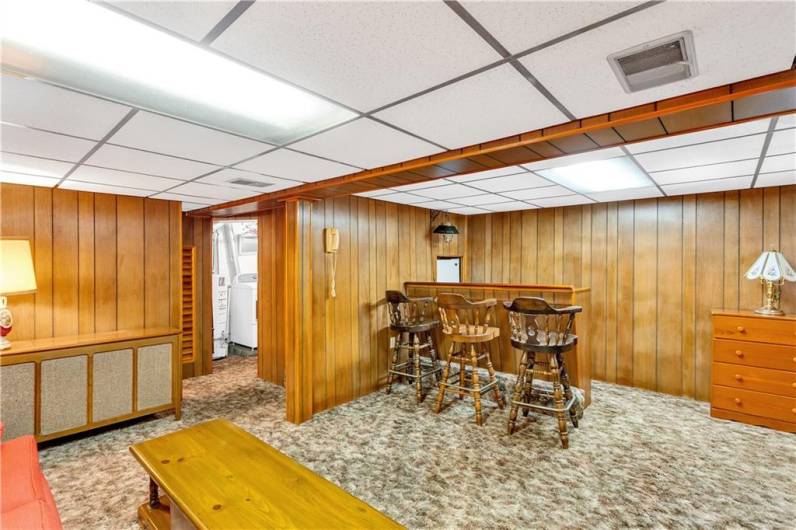 basement lounge area showing bar