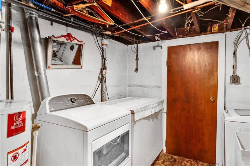 laundry area with door to integral garage