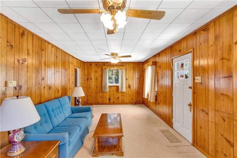 another living room view, showing front door