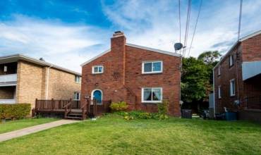 ADORABLE HOME WITH A FLAT YARD AND WRAP AROUND DECK!