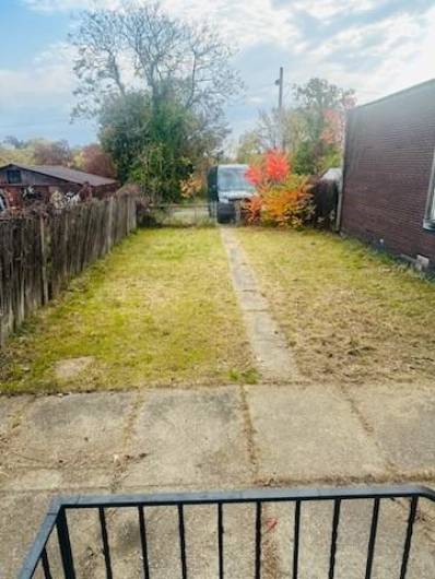 Step through the door off the dining room to a small landing and out to the level back yard.  At the back of the yard is the space for your 2 vehicles.