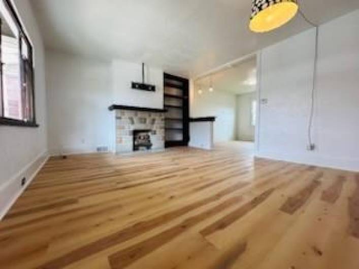 Isn't this an excellent floor?  The archway leads to the dining room.