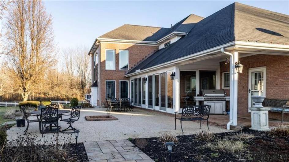 Back of house showing the 4 Season Patio and courtyard