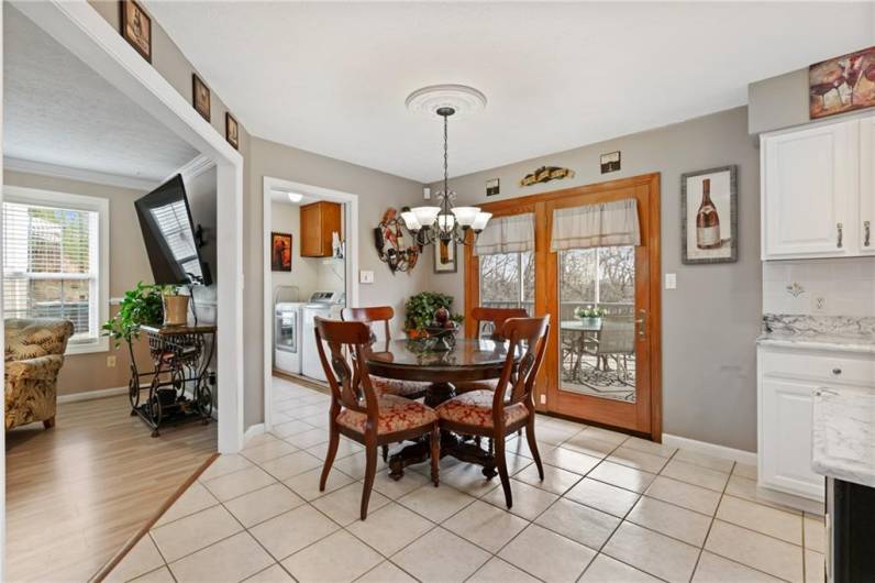 Access the newly screened covered deck via French doors in the spacious eat-in kitchen.