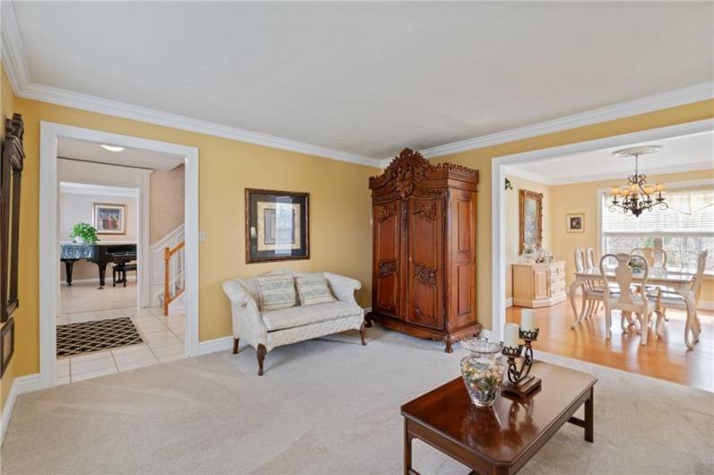Oversized openings to each room create a dynamic floor plan.  Notice the custom upgraded millwork around the doorways.