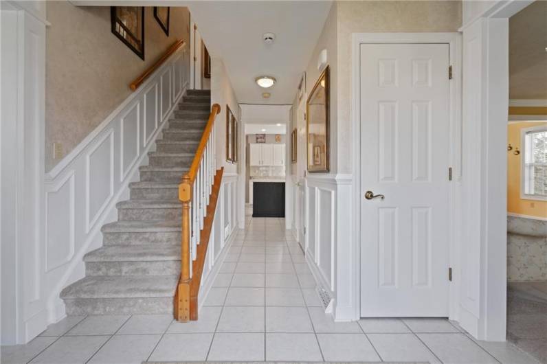 The welcoming entry boasts abundant wainscotting and extensive millwork.  Plush new neutral carpet leads to the upper level.