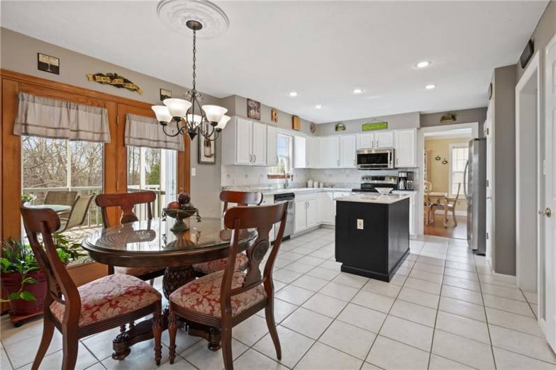 The chef in your home will adore the newly remodeled kitchen with professionally resurfaced white cabinetry, beautiful rich expresso island, beautiful & durable quartz countertops, recessed lighting, and deluxe stainless appliances.