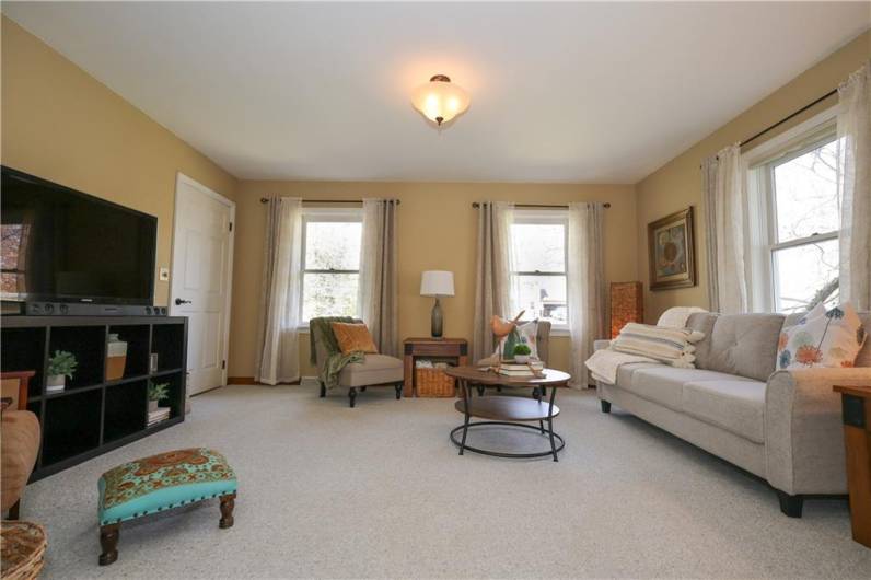 The formal living room is to the left of the foyer. It has two solid doors from the entry and the FR so it can be closed off and used as a 1st floor bedroom. Full bath and laundry on main floor promotes one level living!