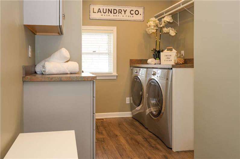 WOW! Laundry won't be such a chore in this delightful room with plenty of extra storage!
