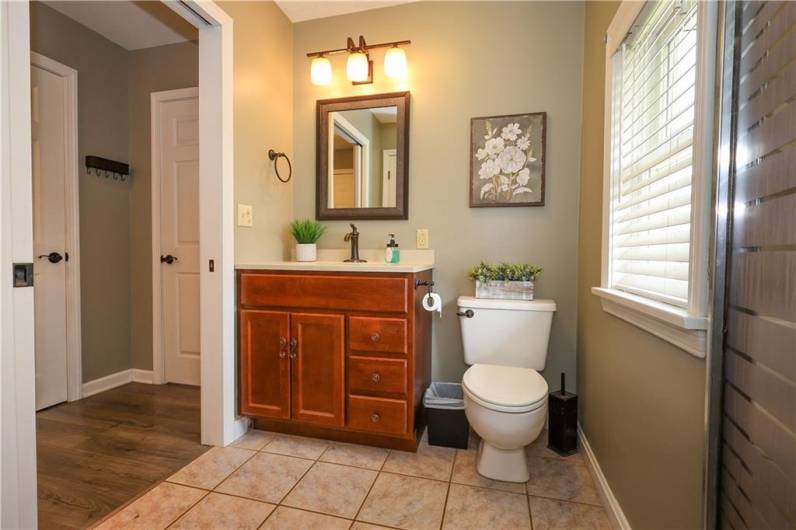 This bathroom off of the kitchen is a FULL bath with a walk in shower!