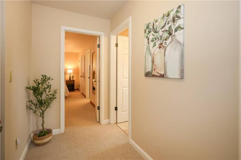 Large hallway as you walk up the steps to the second level