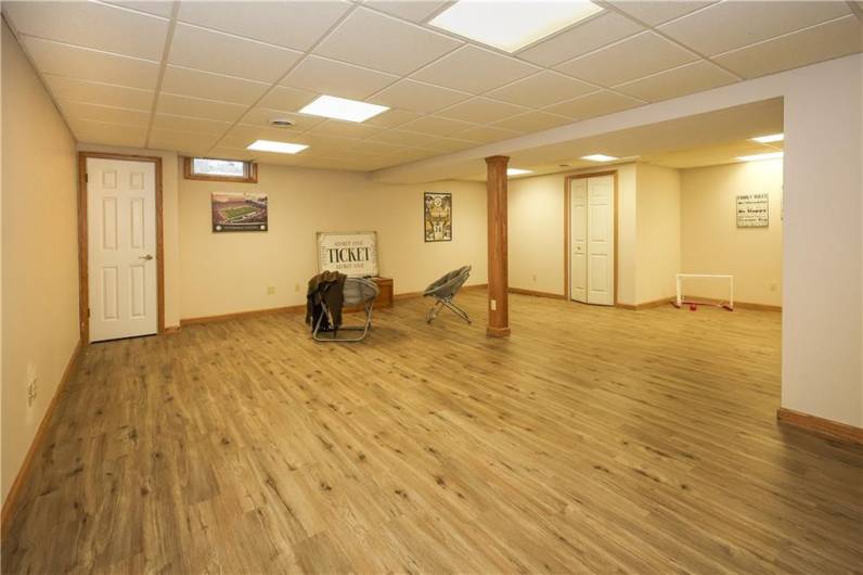 This 25x24 Game Room in the basement has SO MANY possibilities!!