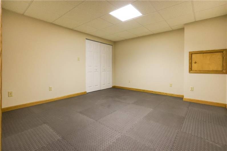 This 13x12 room in the basement is the perfect home gym with the rubber mat flooring!