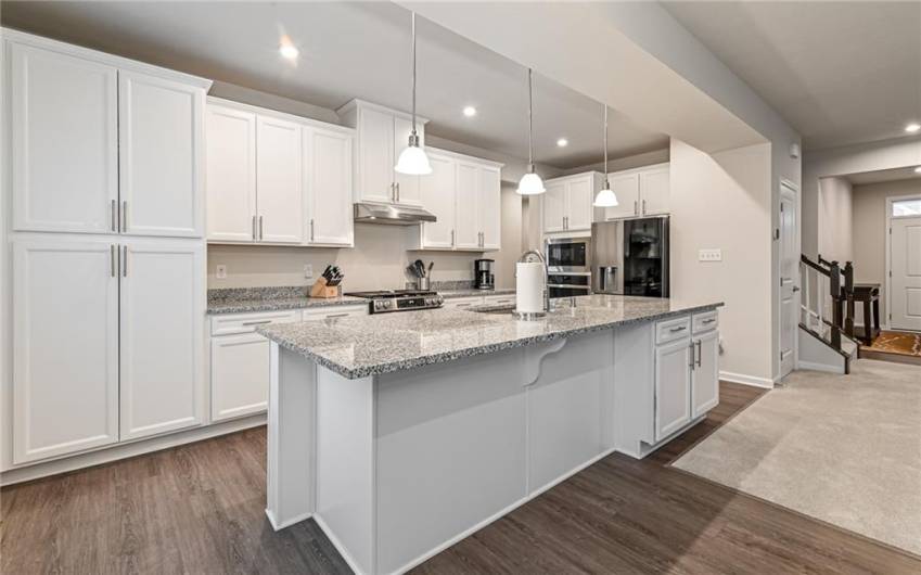 Spacious kitchen with two ovens, granite countertops and plenty of storage