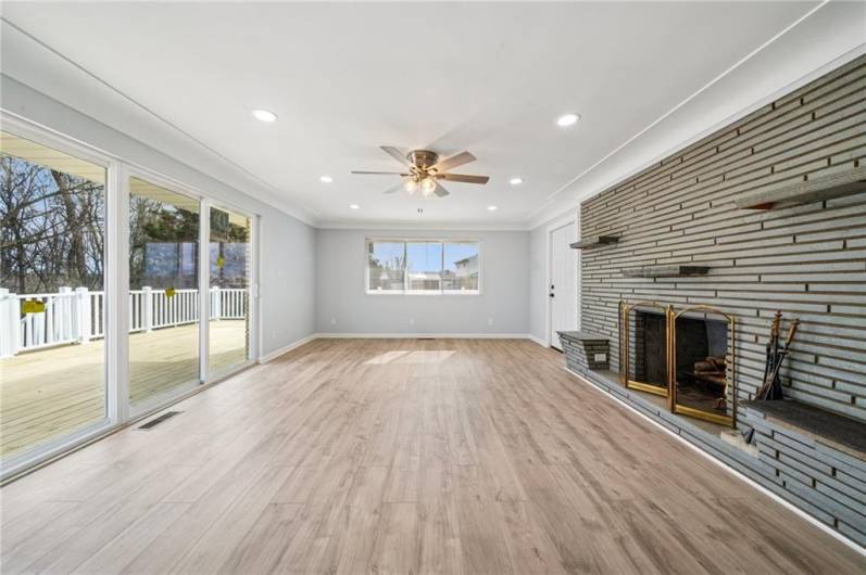 BIGGER THAN IT LOOKS.  LARGE DOORS AND WINDOWS ALLOWING PLENTY OF NATURAL SUNLIGHT TO ENTER HOME.