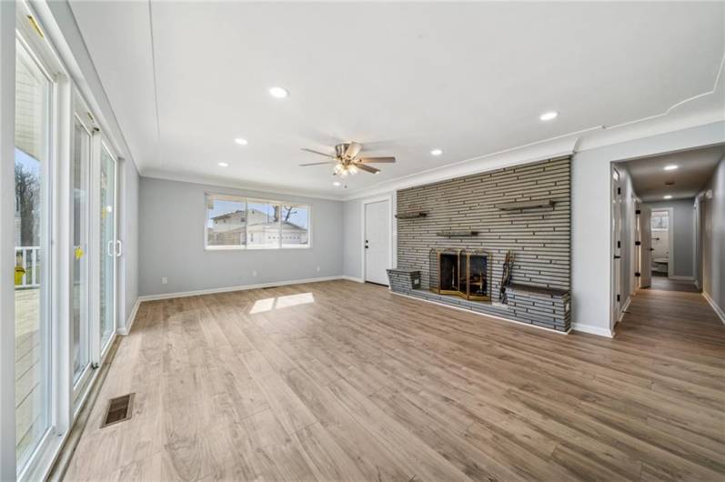 LIVING ROOM (21X15) HAS SLIDING DOORS TO A WRAP AROUND DECK AND DOOR TO FRONT PORCH.
