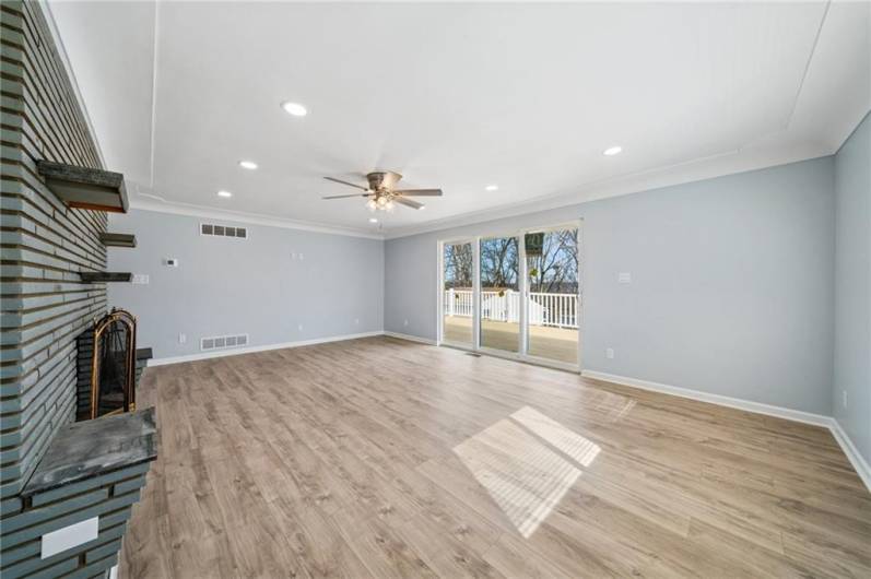BEAUTIFUL LIVING ROOM.  ACCESS TO WRAP AROUND PORCH AND VIEWS REAR TREED YARD.