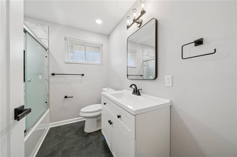 MAIN BATHROOM ON MAIN LEVEL AT END OF HALL