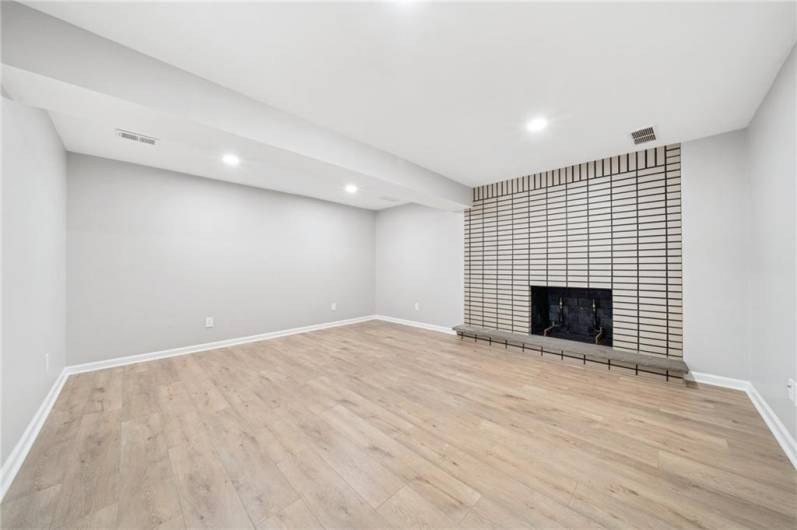 LOWER LIVING AREA.  THIS COULD ALSO BE A 6TH BEDROOM IF YOU NEEDED. THE ROOM IS ~17X14