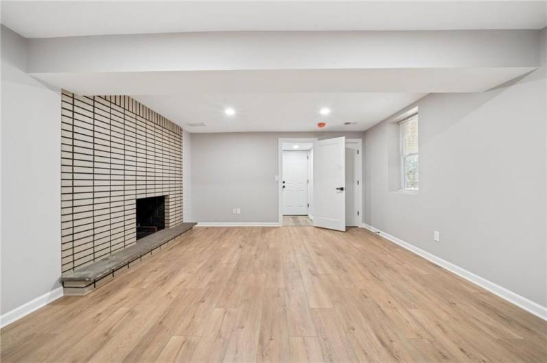 LOWER LEVEL GAMEROOM OR IN-LAW SUITE LIVING AREA.  HAS 2ND FP.