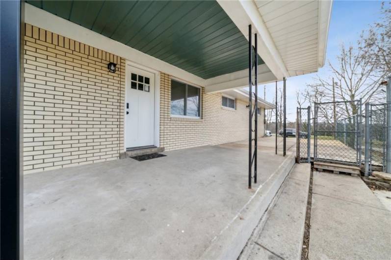 COVERED PORCH.  EASY ACCESS FROM OFF STREET PARKING AREA TO MAIN LEVEL.