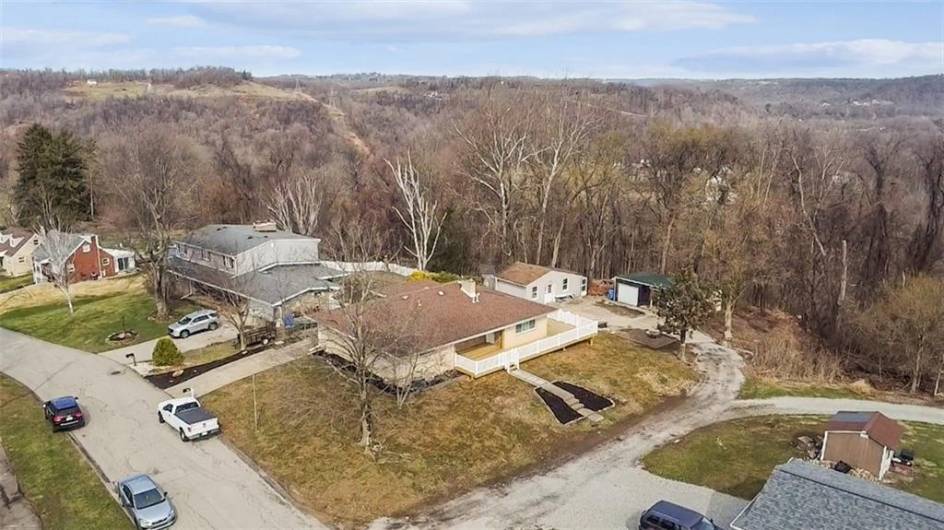 AERIAL VIEW - HOME HAS 2 DETACHED GARAGE W/STORAGE AREA IN BETWEEN + HUGE STORAGE/HOBBY ROOM/SHED