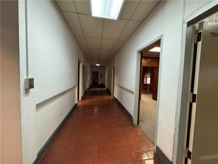 Main level, rear staircase to E Beau St entrance.