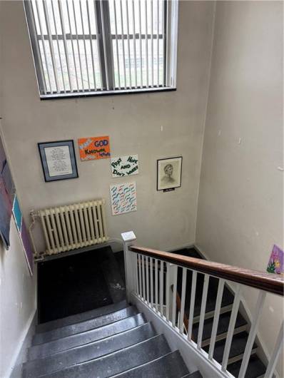 3rd floor staircase to main entrance on S College St.