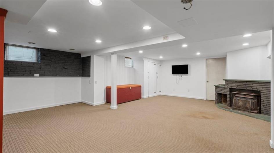 Large game room with wood burning fireplace