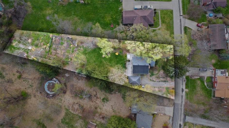 .89 acres of very usable ground.  Relatively flat until the garden, then gentle slope to another flat area.