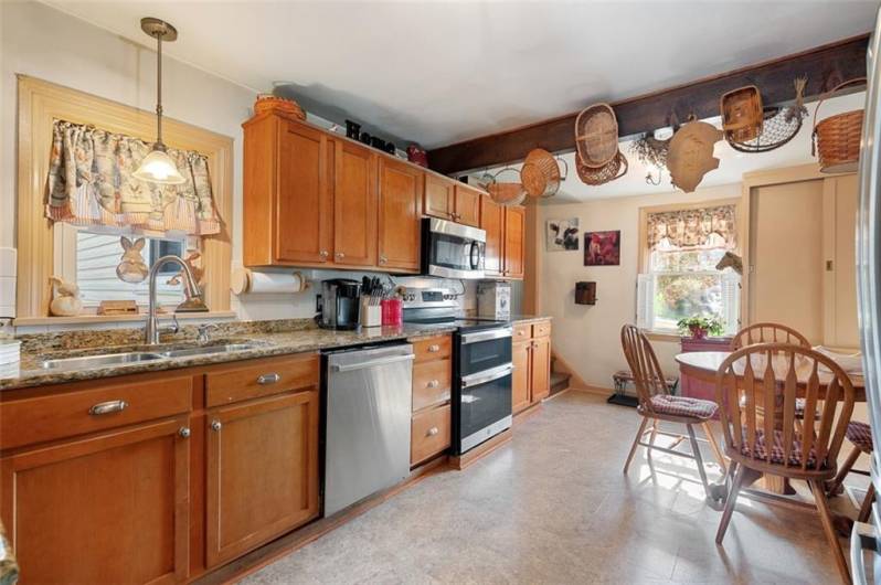 Light, bright and cheerful easily describes this farmhouse kitchen with new appliances.