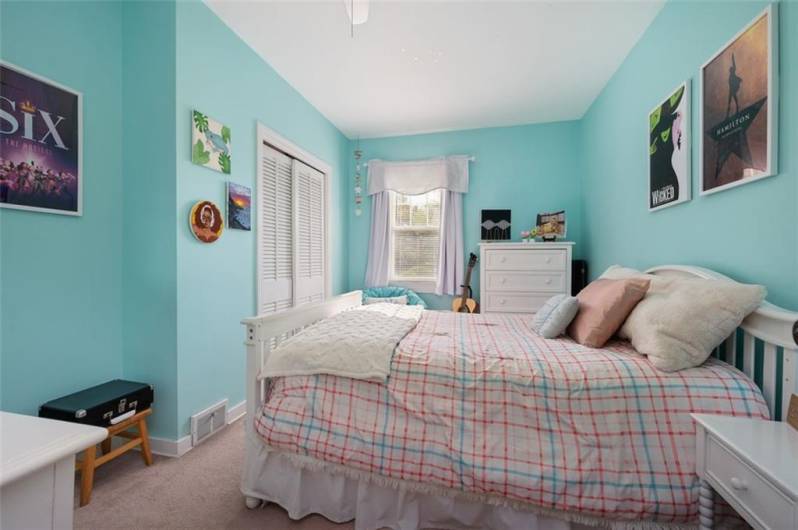 One of the five bedrooms on the second floor.