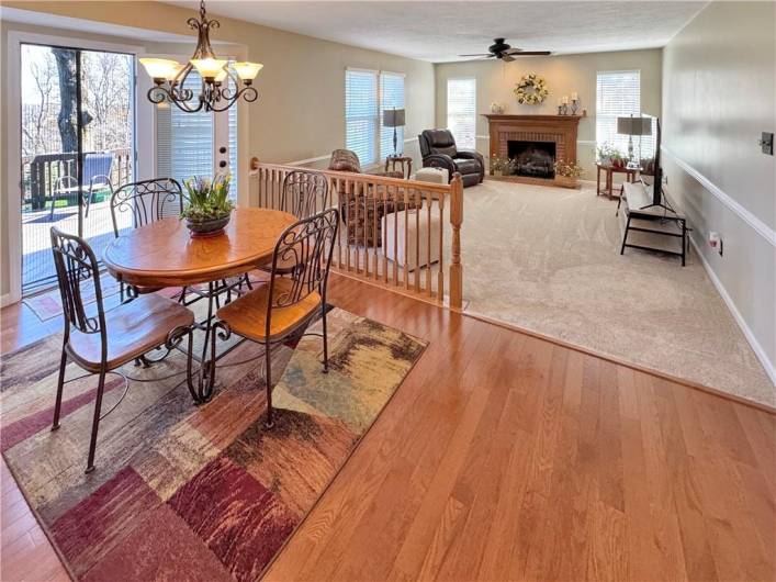 Sunny breakfast area with bay window and door to deck.