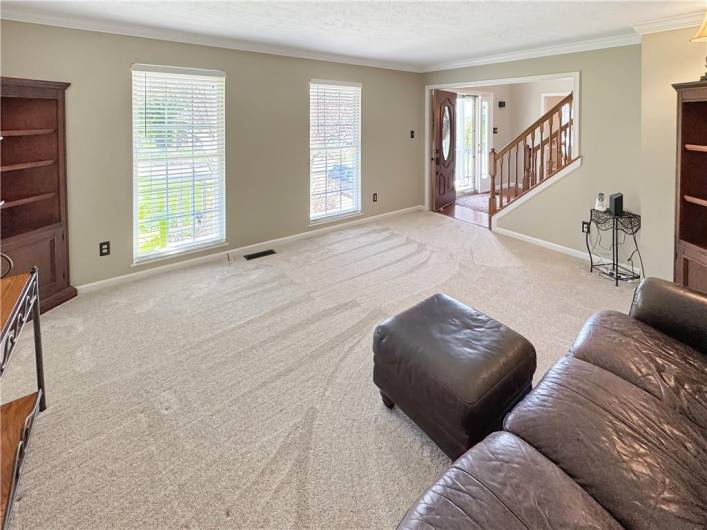 The living room is accented with crown moldings.