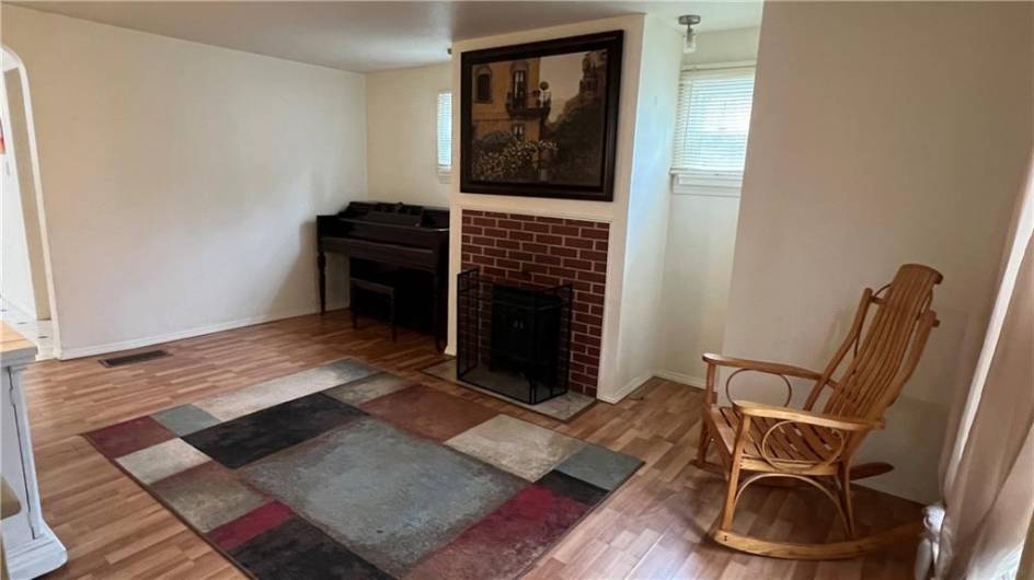 View from the front door and base of stairs leading to the second floor.