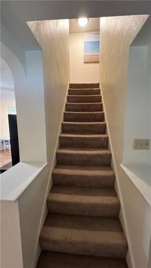 View of stairs leading to the second floor.