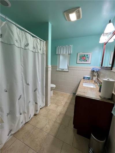 Main Full Bathroom with tub and shower