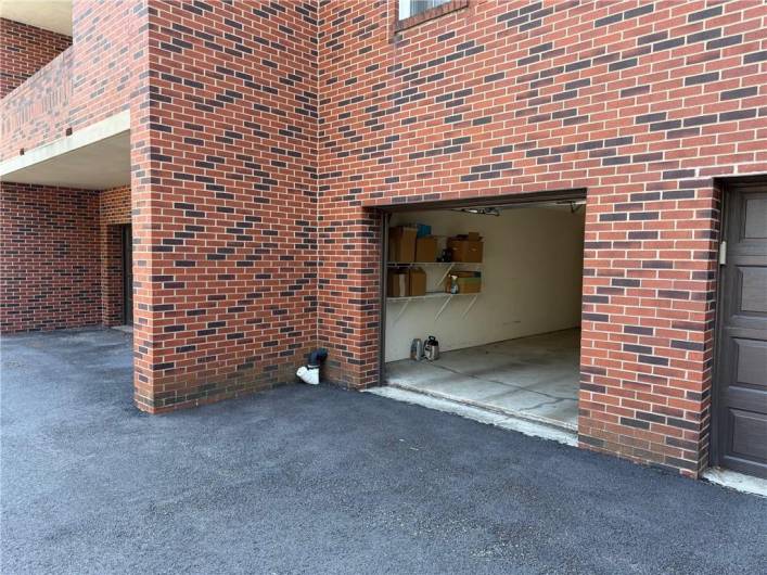 Large 1 car accessed from the exterior and interior of the building.