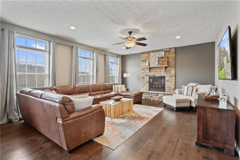 Great natural light & stone fireplace make this living room pop...