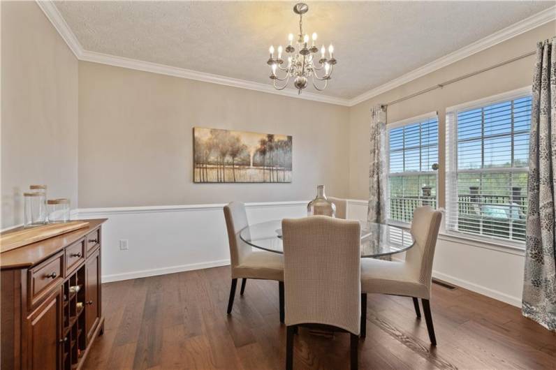 Crown molding & chair rail add a touch of elegance to the dining room...