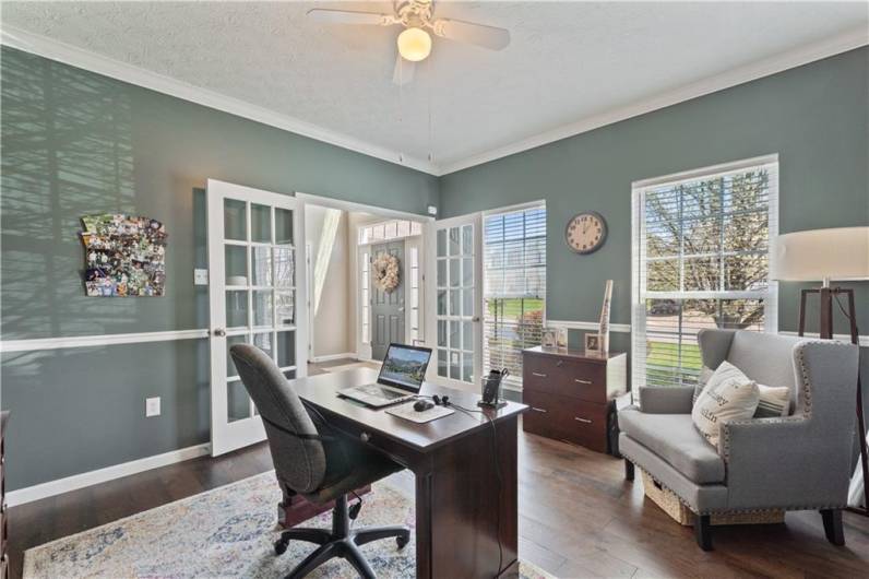Crown molding, chair rail, French doors - this is the perfect work from home set-up!!