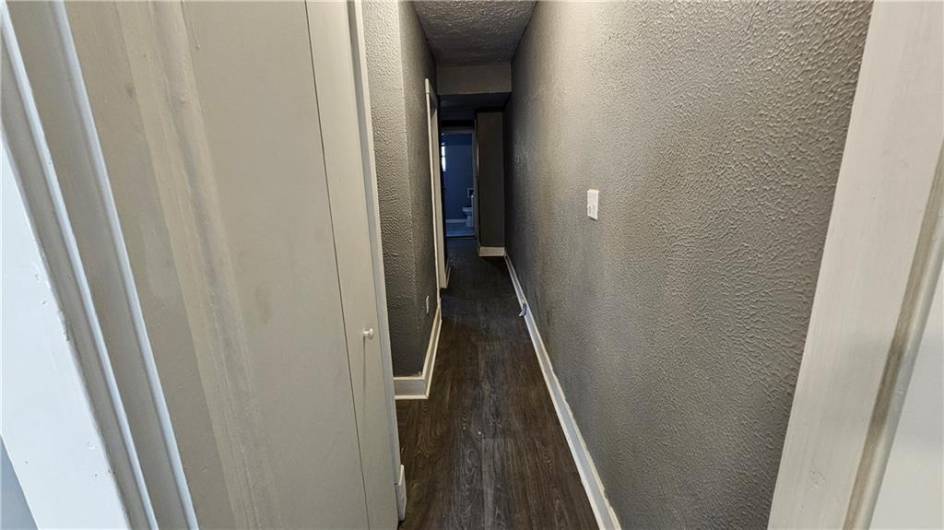 Hallway that leads to 2nd bedroom, additional closet, and bathroom