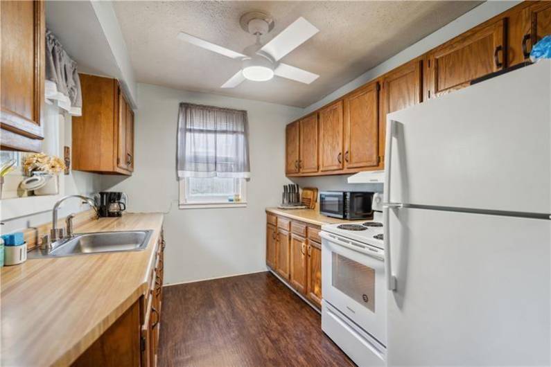 Additional view of kitchen. Plenty of room for your coffee bar & to prepare meals.