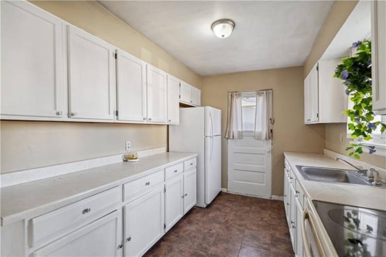 Additional view of the kitchen.